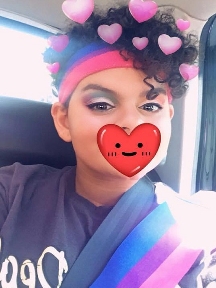 Mya in 2018 with her heart in her mouth...& in her hair